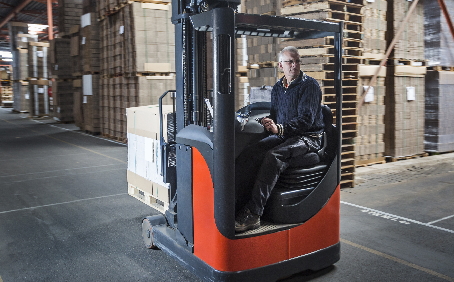 Fork lift operator preparing products for shipment